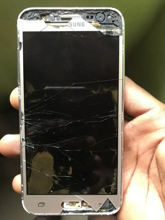 Samsung phone with a badly shattered screen, before replacement