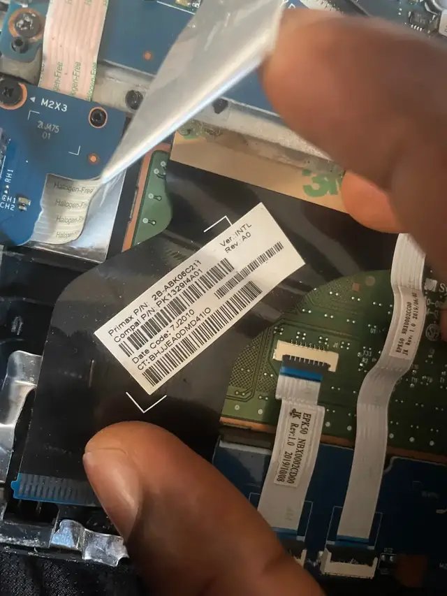 Laptop keyboard ribbon cable being reconnected