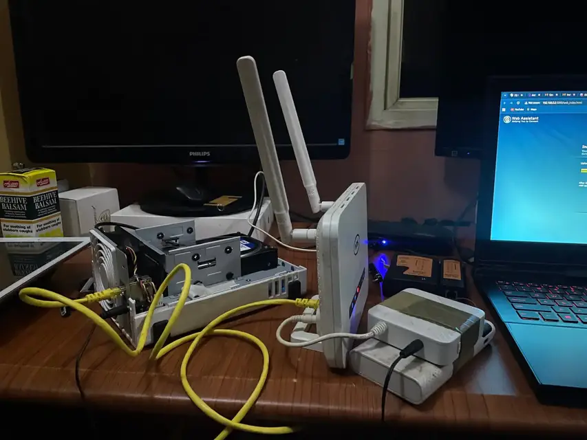 Router and NAS network setup on a desk with Ethernet cables