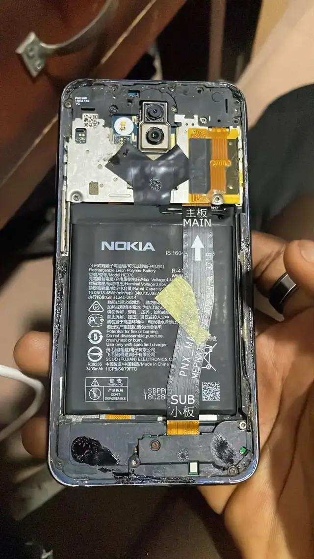 Nokia phone opened up with its back cover removed for repair